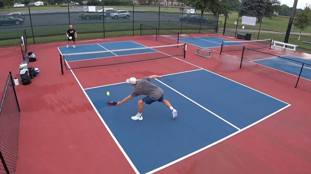 men playing pickleball Play Pickleball on a Tennis Court